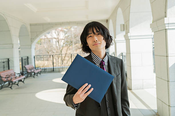 istock Graduation ceremony for male college students 2220516254