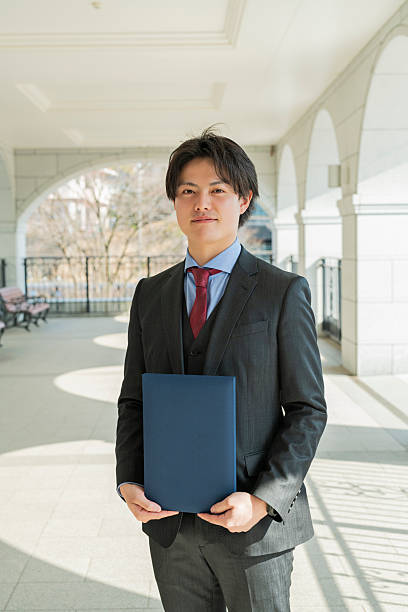 istock Graduation ceremony for male college students 2220516289