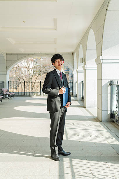 istock Graduation ceremony for male college students 2220517018