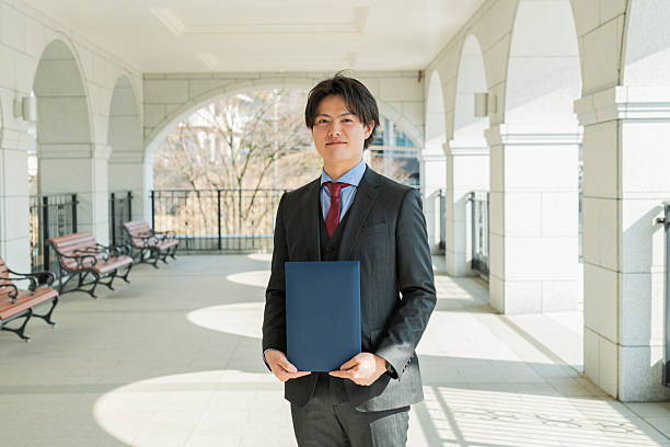 istock Graduation ceremony for male college students 2220517070