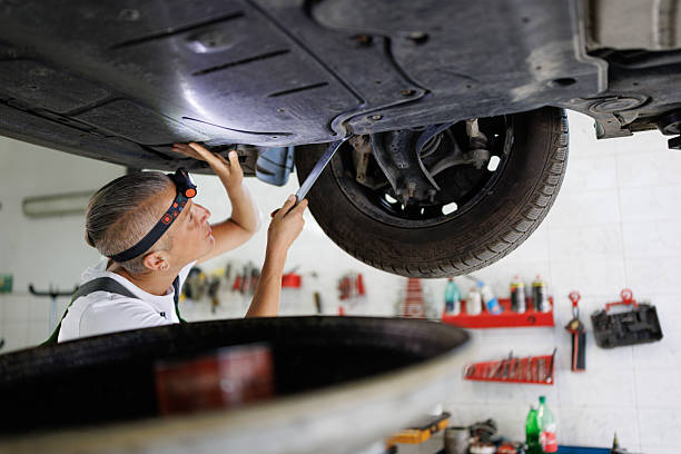 istock Oil Change by Woman with Extractor Tool 2220517194