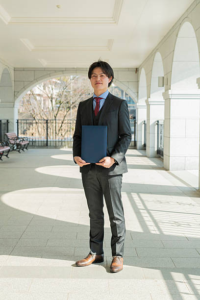 istock Graduation ceremony for male college students 2220517274