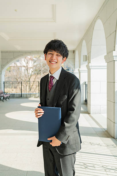 istock Graduation ceremony for male college students 2220517440