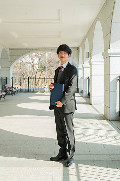 istock Graduation ceremony for male college students 2220518401