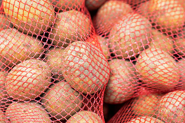istock young white potatoes packaged in red nets in a supermarket 2220518470