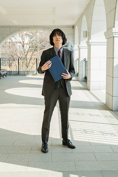 istock Graduation ceremony for male college students 2220519050