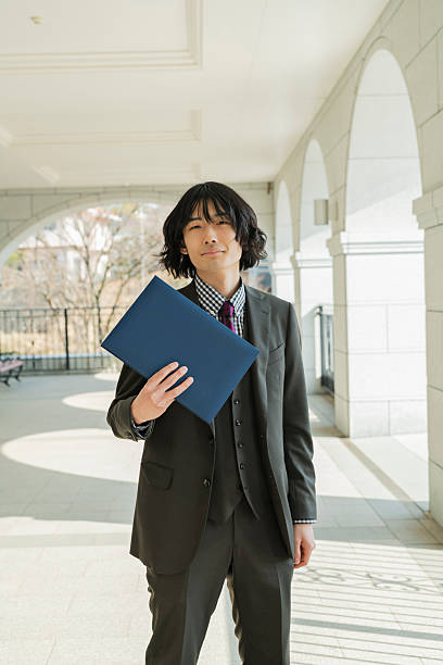 istock Graduation ceremony for male college students 2220519157
