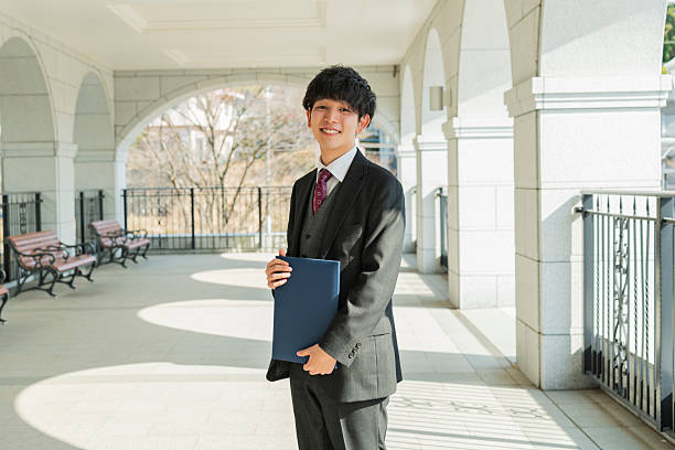 istock Graduation ceremony for male college students 2220519415