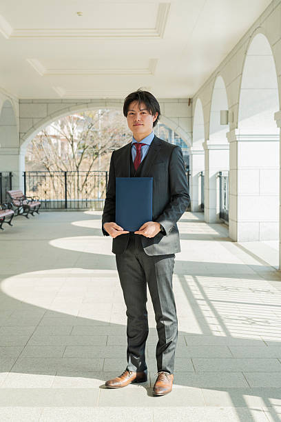 istock Graduation ceremony for male college students 2220519500