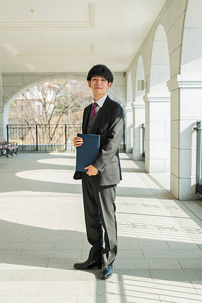 istock Graduation ceremony for male college students 2220520106