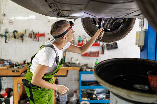 istock Female Technician Conducting Oil Change with Vacuum Pump 2220520457