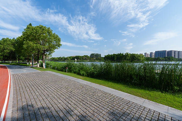 istock Running path in city park during sunset 2220523027