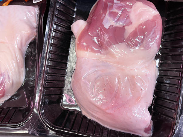 istock Raw chicken thighs in a vacuum package ready for cooking. Close up. 2220529935