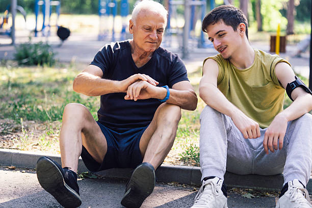 istock Older man and young man bonding after exercise moment 2220530512