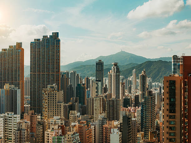 istock Modern Hong Kong Skyline with Mountain Backdrop on a Sunny Day 2220533143