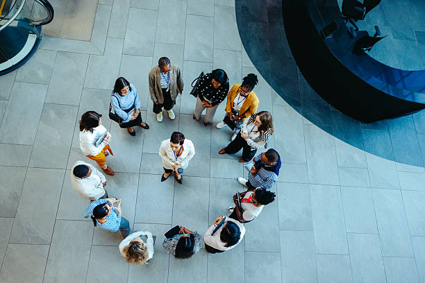istock Overhead view of diverse group circle meeting in corporate setting 2220538248
