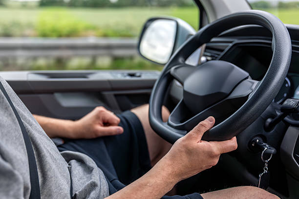 istock Driver hands on steering wheel. Inside car driving. Road control on highway. 2220539066