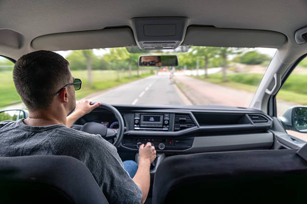 istock Urban road trip. Car interior. Focused driver. 2220539300