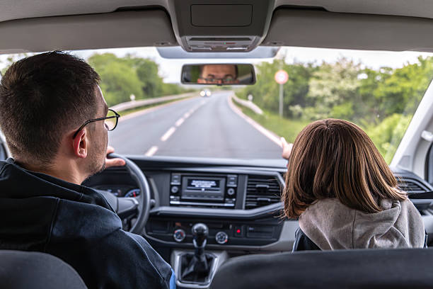 istock Hand pointing. Spring road. Forest travel 2220539308