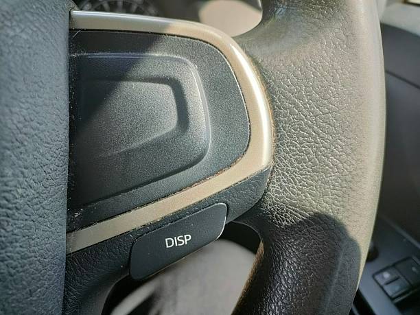 istock Close-up of steering wheel control buttons in a modern car, 2220539324