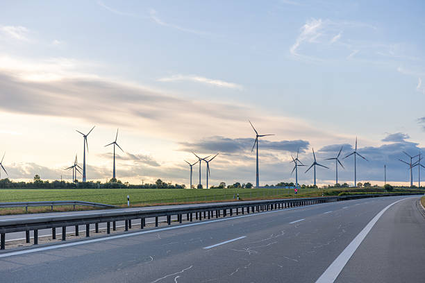 istock Highway and wind turbines. Sustainable infrastructure. Clean energy. 2220539458