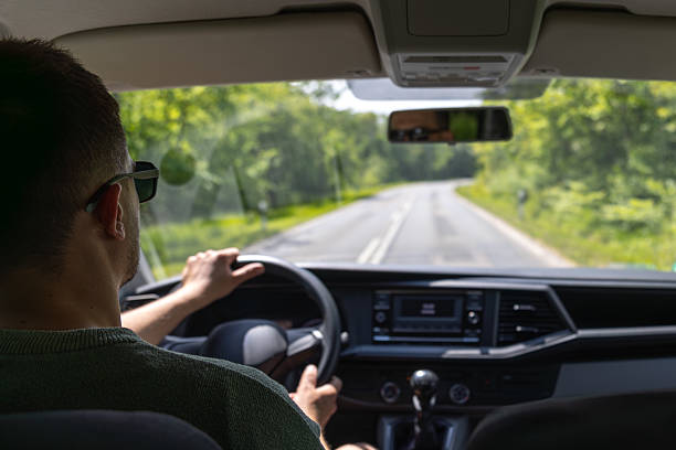 istock Driver on rural road. View from car interior. Moving forward. 2220539576