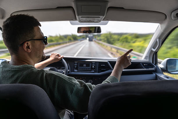 istock Driver on a bridge. Road trip view. Man driving car. 2220539581