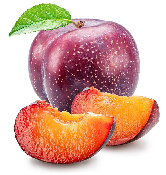 Ripe chinese plums with green leaf isolated on white background. File contains clipping paths.