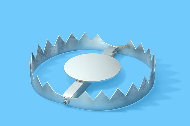 istock Open metal trap isolated on blue background. Clipping path included 2220545235