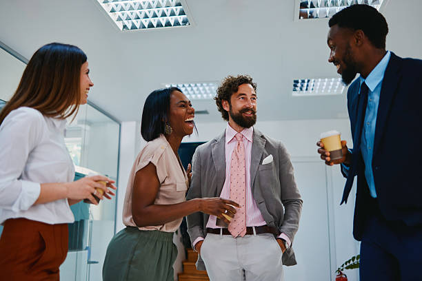 istock Multi-ethnic business people talking and laughing during coffee break 2220545610