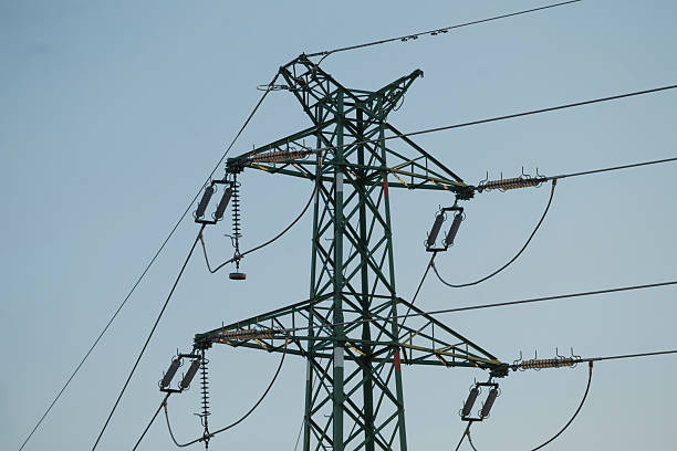 istock A tall green power tower stands against a bright blue sky 2220546173