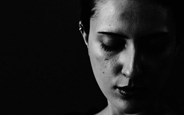 istock Woman in the dark. 2220546513