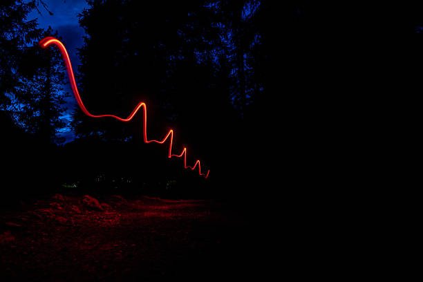Futuristic light shapes in the dark in the mountain