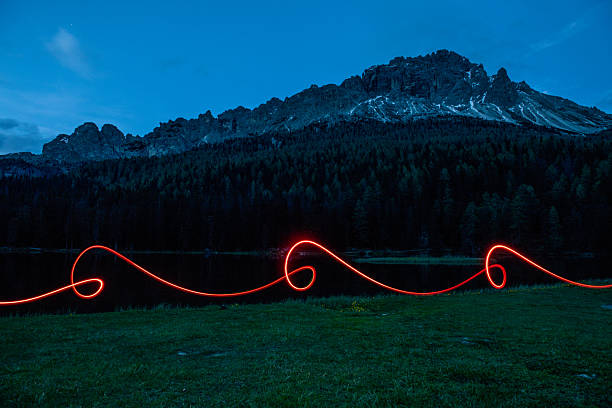 Futuristic light shapes in the dark in the mountain