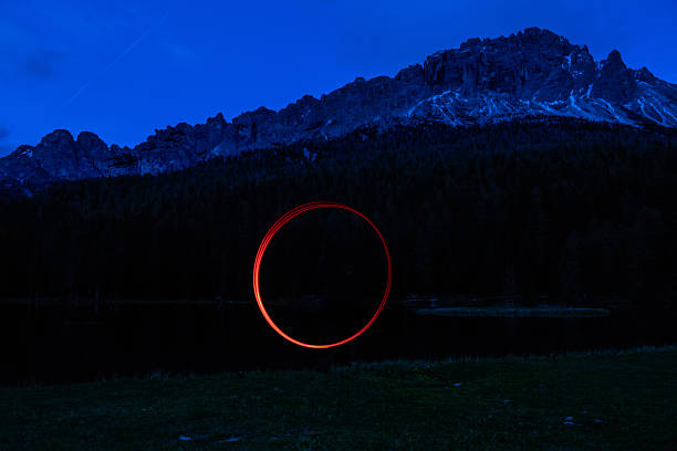 istock Futuristic light shapes in the dark in the mountain 2220548998