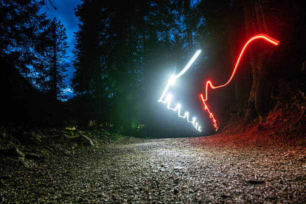 Futuristic light shapes in the dark in the mountain