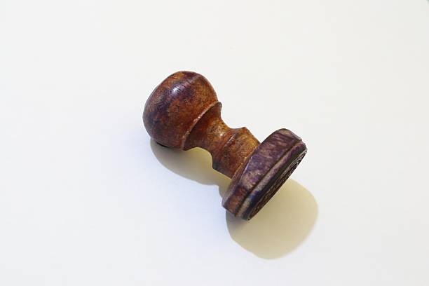 Old wooden office hand stamp on desk