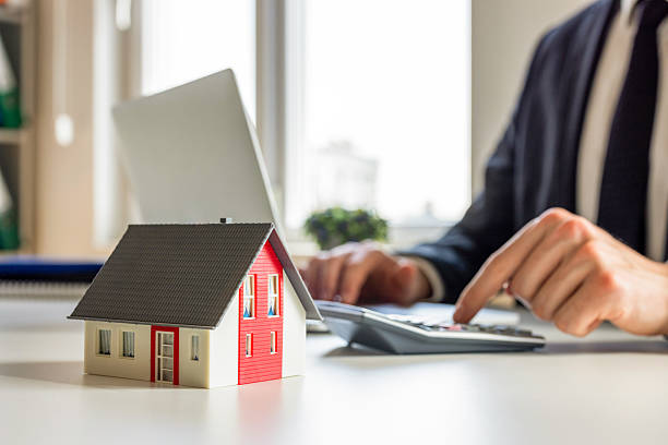 istock Man calculating house rents 2220561998