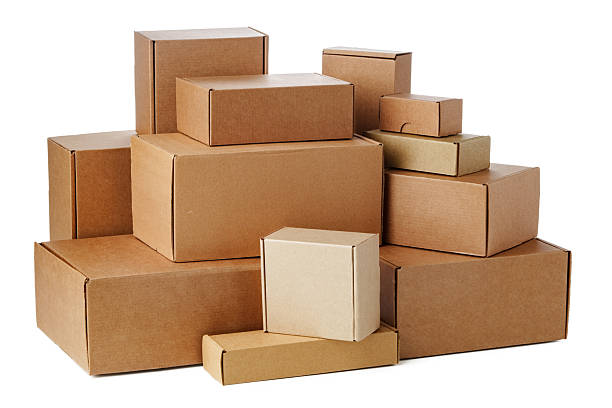 istock Stacked brown cardboard boxes in various sizes arranged on a white background 2220562481