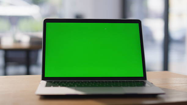 istock Mockup laptop standing office desk closeup. Modern green screen computer online 2220563194