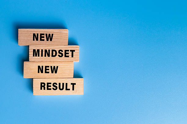 istock new mindset new result words text on wooden blocks isolated on blue background 2220563272