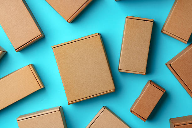 istock A collection of cardboard boxes arranged on a bright blue surface 2220564416