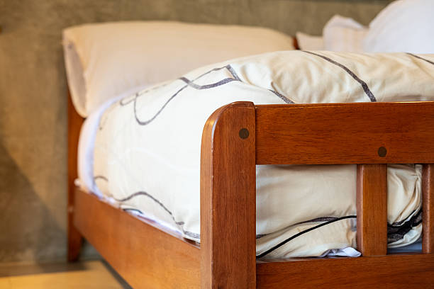 istock Wooden bed with mattress 2220565447