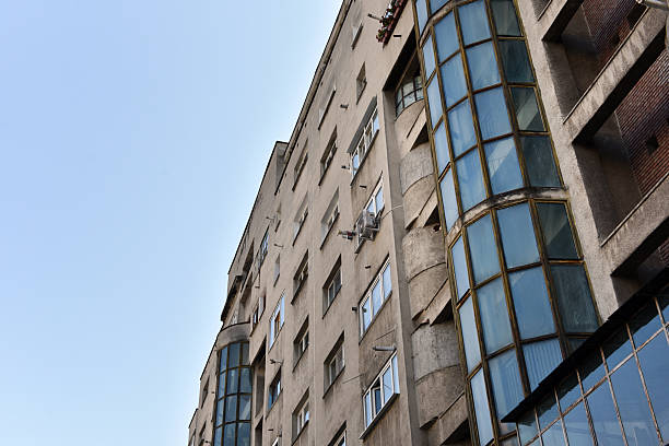 istock Typical facade of concrete panel building. Post Soviet flat of blocks 2220565928