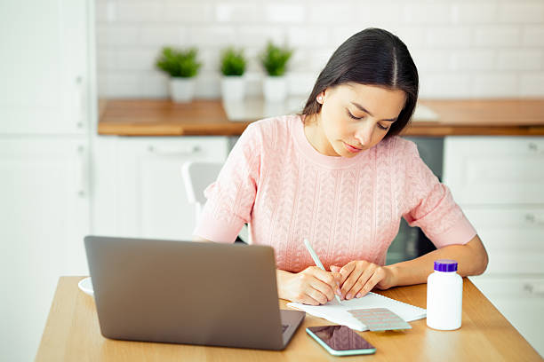istock Woman working with laptop computer at home 2220568001