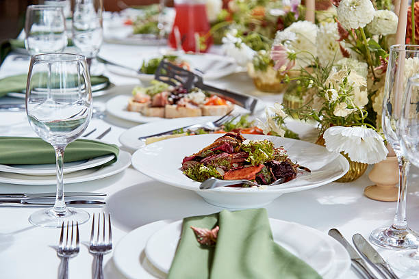 istock Graceful aesthetics table setting, arranged flowers under natural light. Cozy holidays table setup 2220568344
