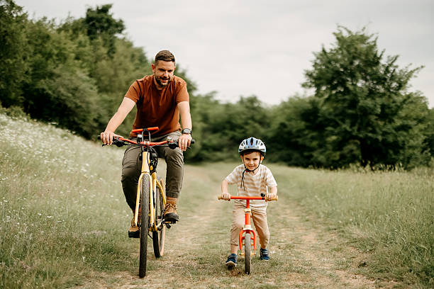 istock Father and son riding bicycles. 2220569287