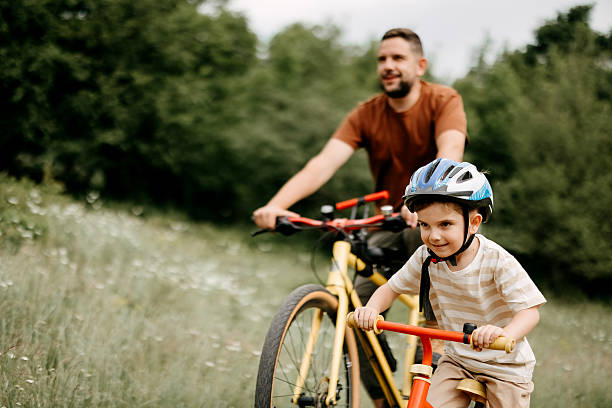 istock Father and son riding bicycles. 2220569300