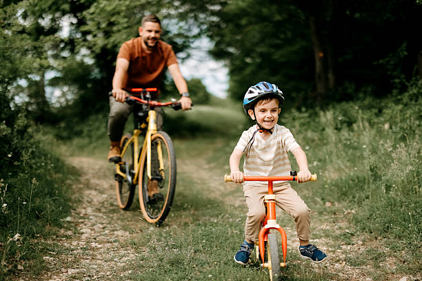 istock Father and son riding bicycles. 2220569302