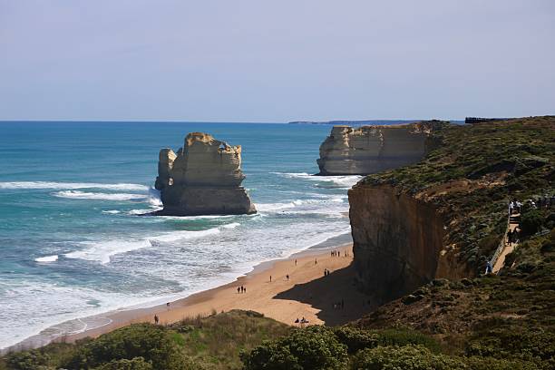 Gibson Steps, on the Great Ocean Road, offers stunning coastal views with towering cliffs and beach access to admire two of the Twelve Apostles up close, perfect for photography and exploration.